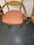 Beautifully hand painted and pinstriped Armchairs, a mustard color with Floral decoration on the crestrail. An Exuberant...