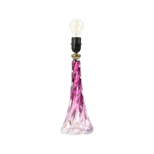 A stunning hand-blown table lamp made of purple-tinted crystal, featuring a striking, quarter-turn twisted blown form and...