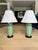 Pair of Frederick Cooper table lamps featuring elegant celadon crackle-glazed ceramic urn forms adorned with decorative...