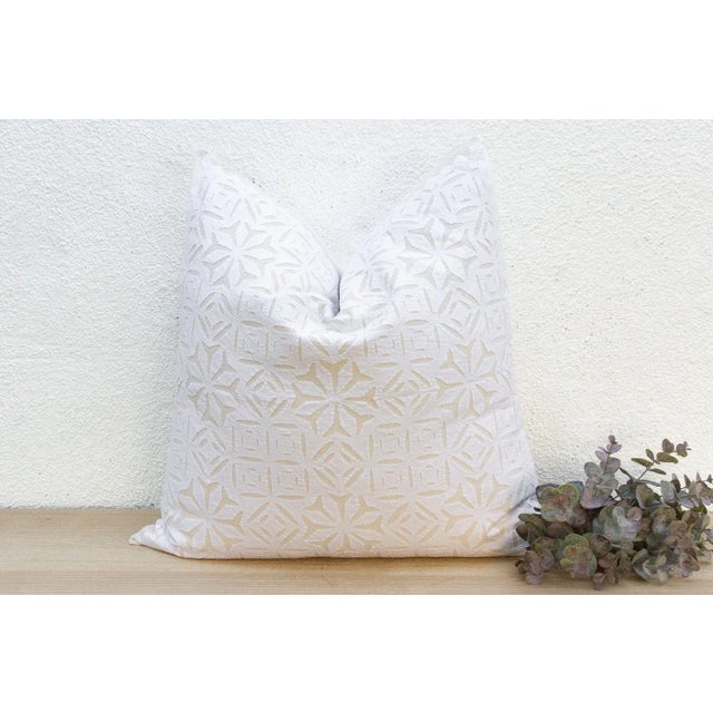 This decorative pillow cover features beautiful array of patterns, with hand crafted appliqué cut work, giving it a...