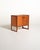 The "Domino" cabinet designed by Arne Wahl Iversen in the early 1960s. Made of teak, it features two doors with...