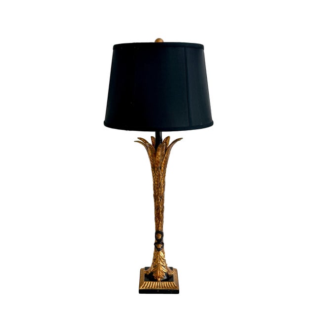 This French vintage Hollywood Regency style palm tree table lamp is sculpted, textured gilt metal or brass crafted to...