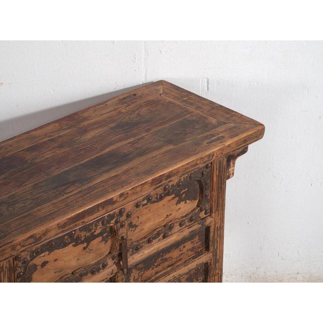 Antique elm console table with iron hardware, China, circa 1900.This piece belongs to the rural furniture tradition of...