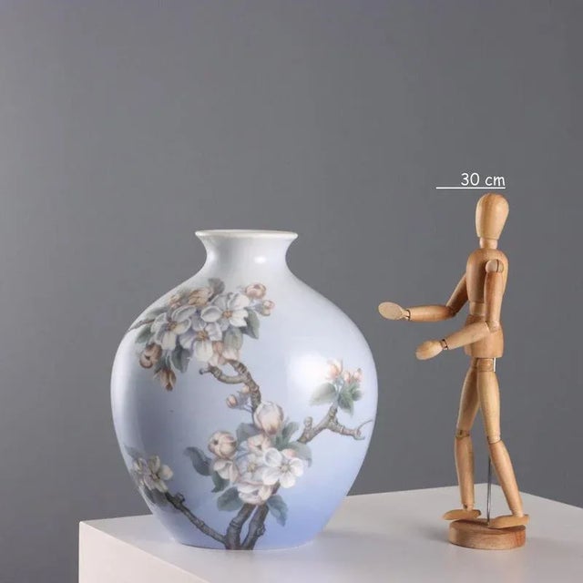 Painted porcelain vase with a blossoming apple branch decoration. Manufacturer's mark, model number, and serial number...