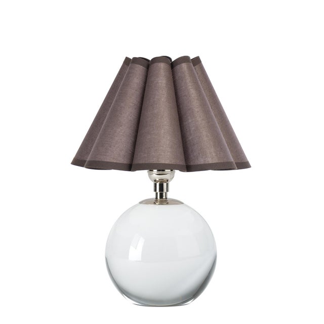 The Giorgio Mini Table Lamp provides a soft, inviting glow through its umber scalloped shade, making it a perfect accent...