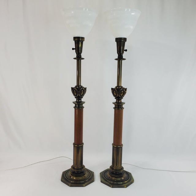 Pair of mid-century torchiere table lamps crafted by the Stiffel Lamp Company. These rare heavy, substantial lamps...