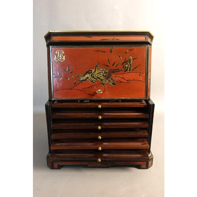 Rectangular cigar humidor with canted corners, crafted from wood and lacquer with a Japanese-inspired design of birds and...