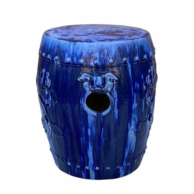 This is a handmade garden clay stool in a round shape with foo dog head accent handle and lotus pattern. The surface is...