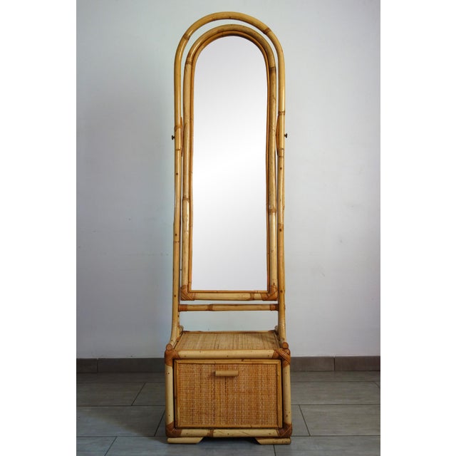Charming cheval mirror in rattan, bamboo, and woven wicker from the 1970s/80s. Made by a French cabinetmaker, it is in...