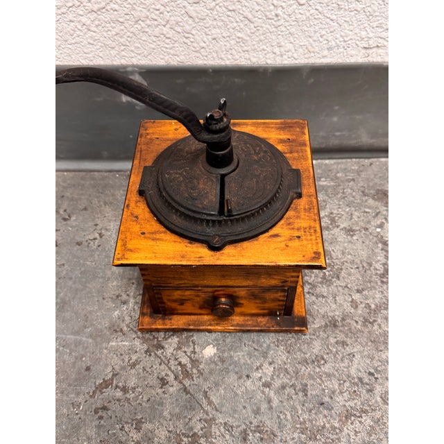 Design Plus Gallery presents an Antique Arcade Imperial Coffee Grinder. The square wooden case displays dovetail joinery,...