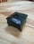 Elegant box is crafted from deep green marble with natural veining, giving it a refined and luxurious appearance. It rests...