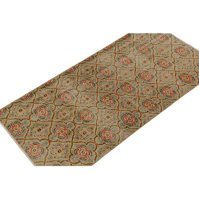 Hand-knotted in wool circa 1960, this 3x6 vintage runner rug is a new curation from Rug & Kilim’s Mid-Century Pasha...
