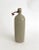 Early 1900s French gray stoneware gin bottle with wired porcelain stopper. Age and patina to this rustic handmade piece.