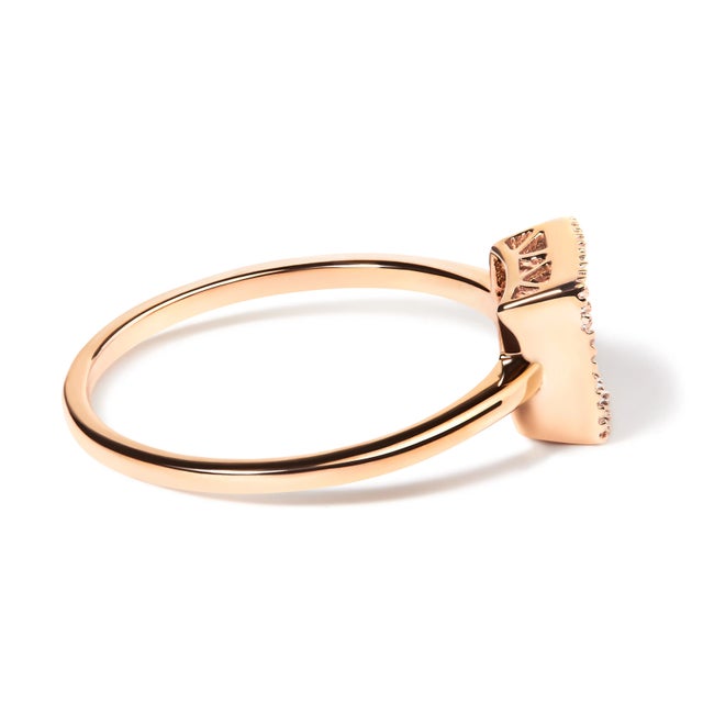 Add shimmer to any look with this eye-catching diamond ring. Fashioned in rich 10K rose gold, this striking style...