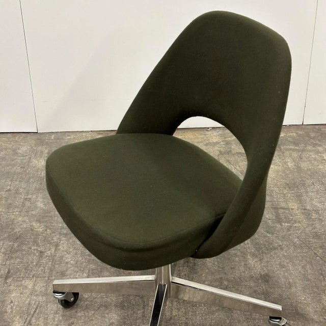 c. 1983. Upholstered in dark green wool. On vaster, height adjustable and swivels.