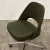 c. 1983. Upholstered in dark green wool. On vaster, height adjustable and swivels.