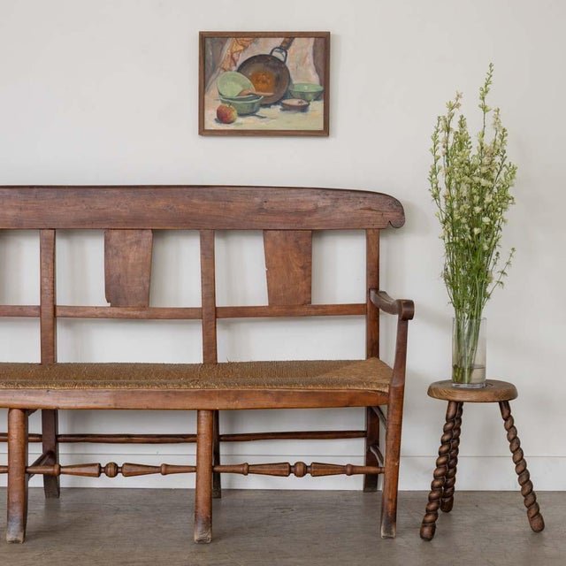 Lovely provincial oak bench from France, 1940s. Simple and timeless design with thick woven rush seat and beautiful carved...