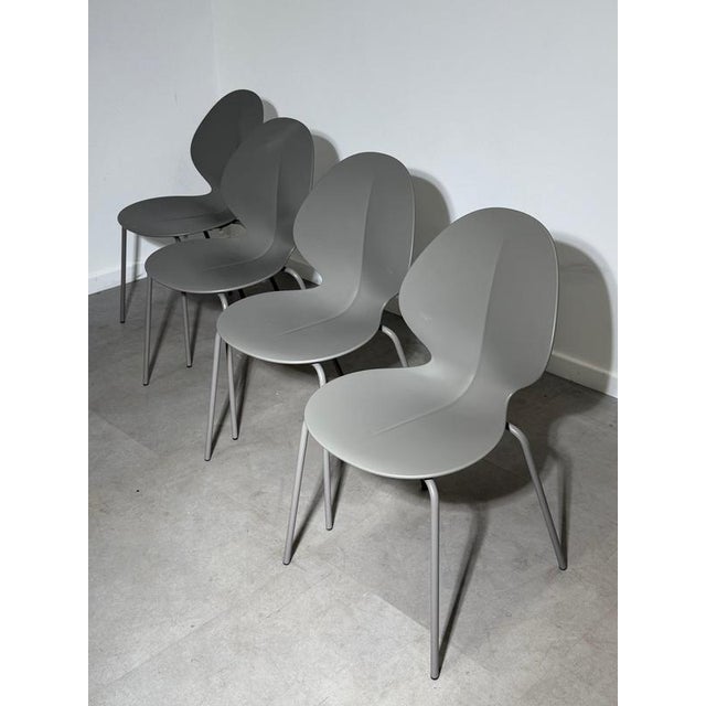 Bring timeless Italian design to your dining space with this elegant set of four Calligaris Basil dining chairs (Model...