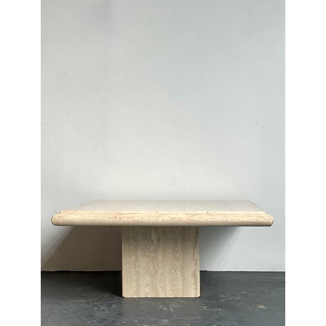 This monumental vintage coffee table is a masterclass in Postmodern minimalism and architectural stone craftsmanship....