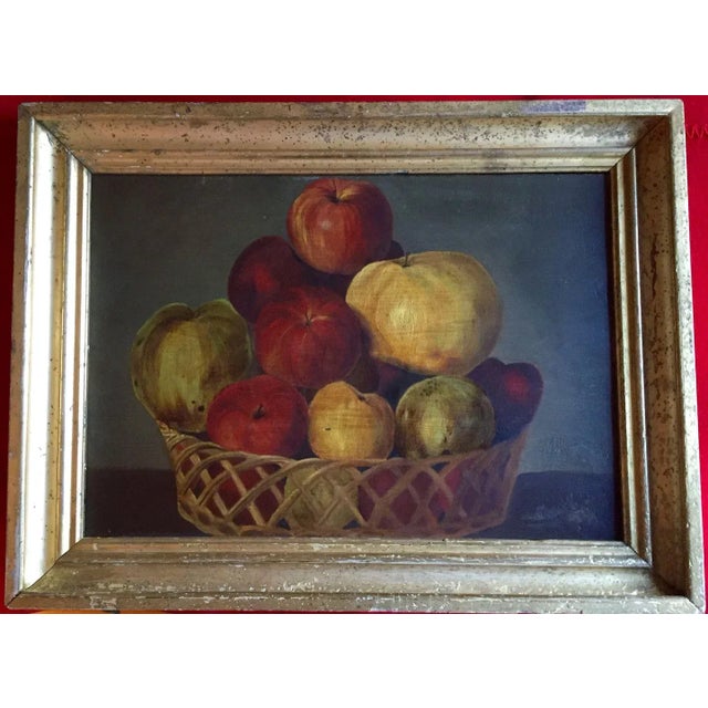 Antique early 19th c. American still life oil painting of a basket of apples. The scale is oversized and perspective...
