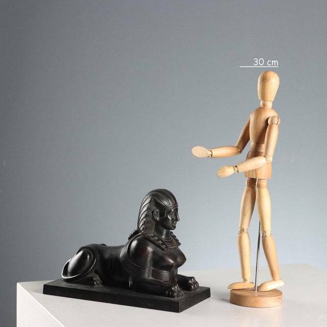 Sculpture depicting a sphinx on a rectangular base. This piece is attributed to the mentioned designer/maker. It has no...