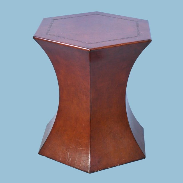 Make a sculptural statement with this pair of hexagonal leather side tables. Their distinctive waisted silhouette —...
