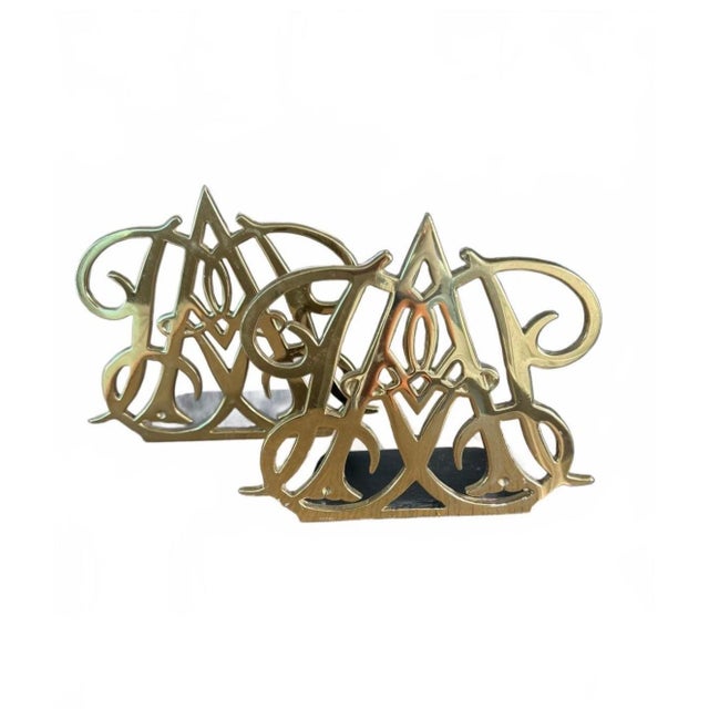 Lovely pair of brass bookends by Virginia Metalcrafters for the Colonial Williamsburg Foundation. Based on the Queen Anne...