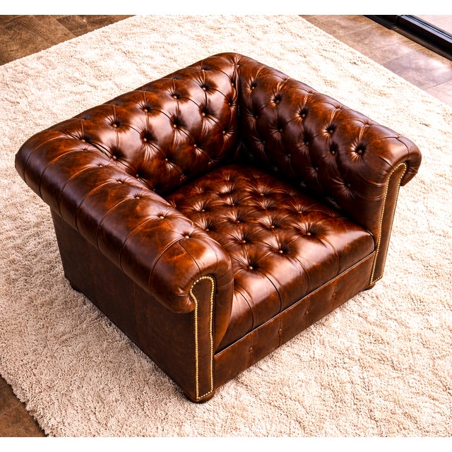 The Belair Rolled Arm Chesterfield Lounge Chair is not only a classic design, but a great addition to any interior...