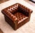 The Belair Rolled Arm Chesterfield Lounge Chair is not only a classic design, but a great addition to any interior...