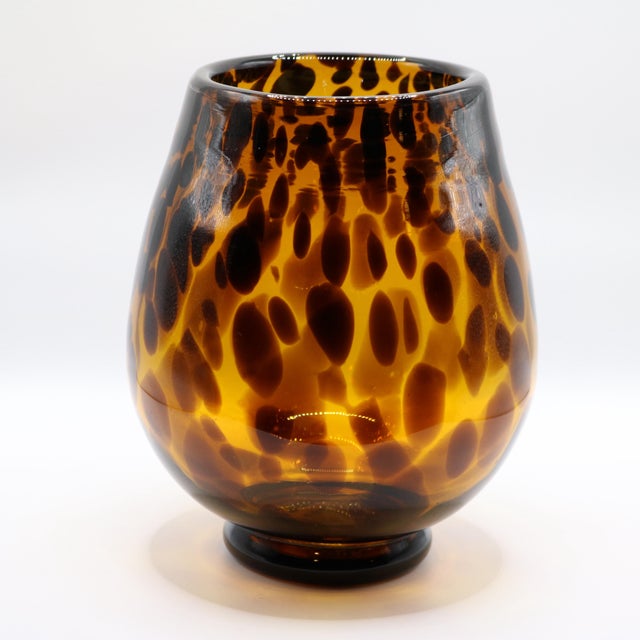 Add a rich, warm glow to your space with this stunning vintage hand-blown art glass vessel. Featuring a classic amber...