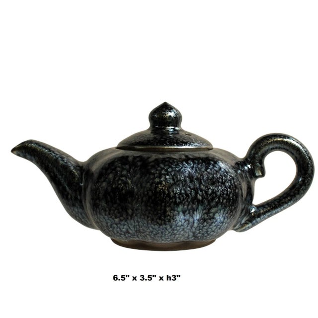 This is a nicely handmade teapot in metallic black and bronze brown marks finish. In Jianyang, Jiankou tea set with a...