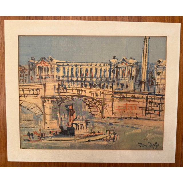 Set of 4 vintage lithograph prints of Paris scenes by the French artist Jean Dufy. The set was published by Donald Art Co...
