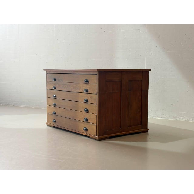 A distinctive plan chest/archive cabinet made of solid wood with exceptionally beautiful proportions and a striking...