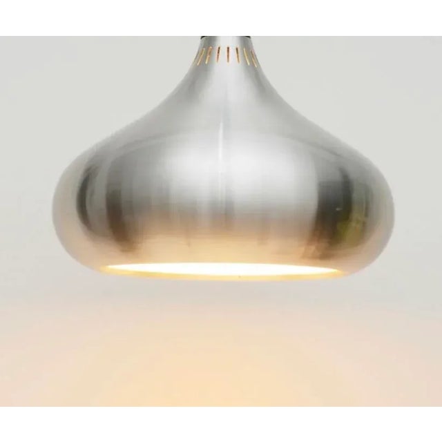 Beautiful silver "Orient" pendant light. The timelessly stylish lamp was designed by Jo Hammerborg for Føg & Mørup and...