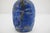 Antique Chinese snuff bottle in deep blue Lapis Lazuli showcasing characteristic white calcite matrix streaks and...