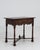 A distinguished example of the William and Mary style, this English side table speaks to the refined cabinetmaking...