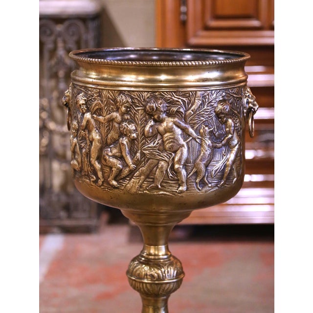 This large heavy antique brass planter was crafted in France, circa 1880. Round in shape, the decorative cache pot stands...