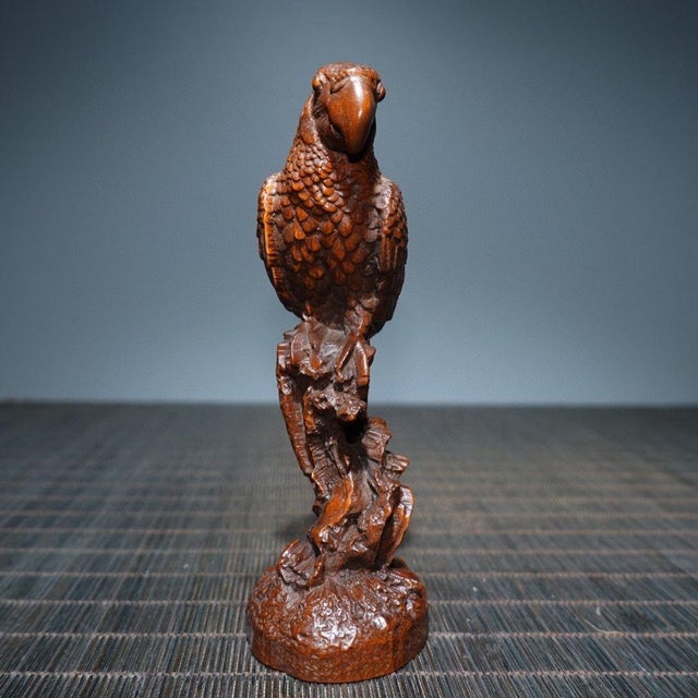 Add a touch of natural elegance to your collection with this finely hand-carved boxwood parrot figurine. This exquisite...