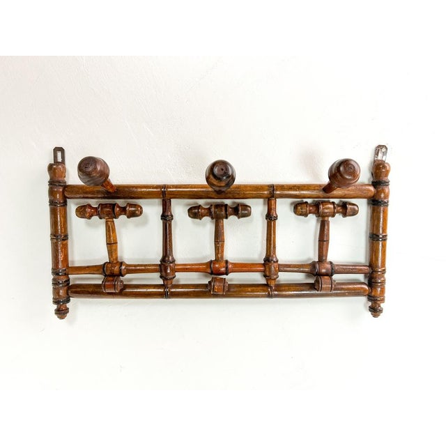 Gorgeous old French Coat rack with folding hooks. Made of so-called Faux-Bamboo period around 1900. This coat rack is not...