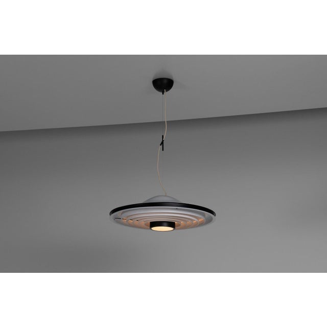 A nice sized and rare chandelier designed and made by stilnovo, italy 1965. This extraordinary piece combines elements...