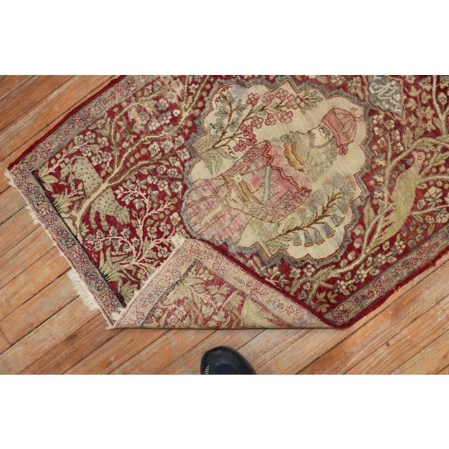 An early 20th century Persian Kerman Pictorial Rug