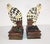A pair of French Art Deco Harlequin/clown bookend/statues. Very detailed. Figures are sitting on two books with their...