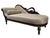 A dramatic vintage récamier (fainting couch) in the French Empire style with a black lacquered frame hand-carved with a...