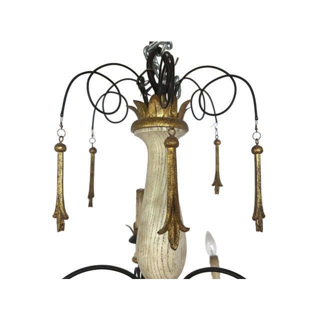 10-light chandelier crafted in the French Country and Tuscan Provincial style, it features a carved wooden center column...