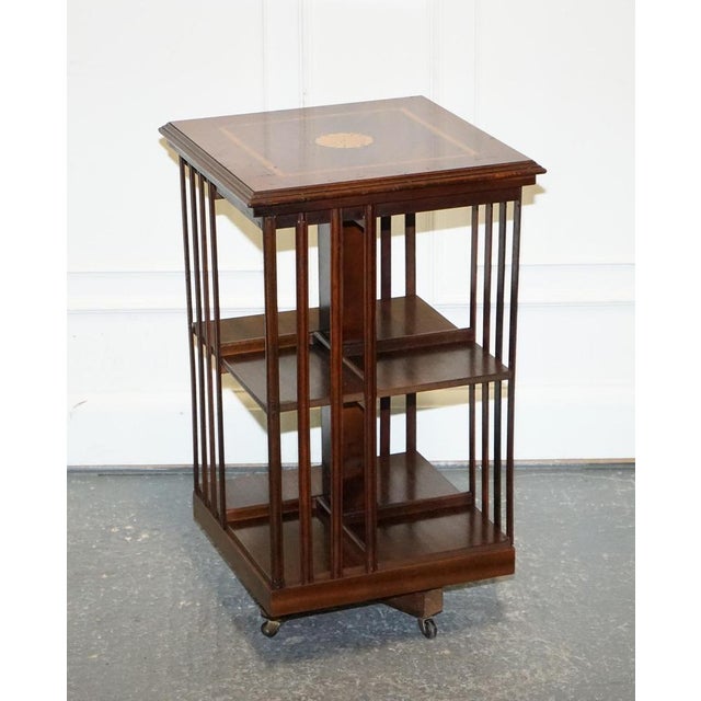 Mid-Century Vintage Sheraton Revival Revolving Bookcase. A solid and well made bookcase in a good condition. There will be...