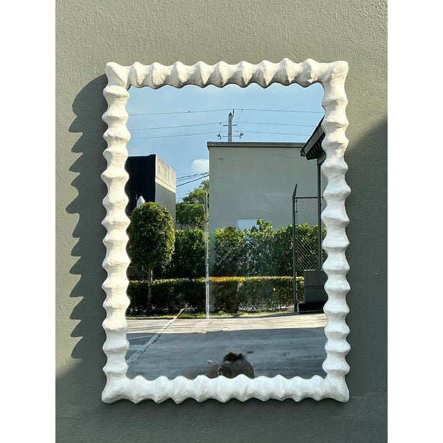 This iconic "Clyde" mirror by Oly Studio is a masterclass in organic modernism and sculptural elegance. Featuring a...