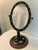 This vanity mirror has two faces. One is practical, the other is beautiful art. The first is the oval mirror measuring 9 x...