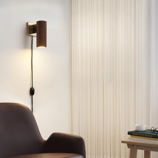 Elevate your space with the Tambo wall sconce from Nova of California. The hand-laid dark Walnut wood tambour surround,...
