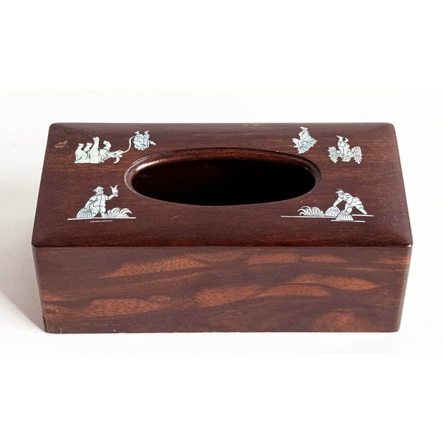 Beautiful rosewood tissue box cover that has been handcrafted with intricate mother-of-pearl inlay scenes of village life,...