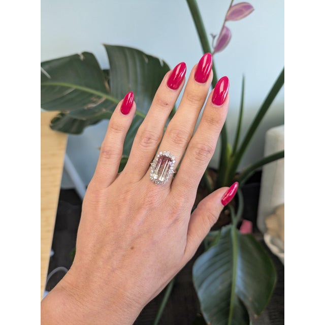 A dramatic 9.24-carat bi-color tourmaline blends two natural hues in a single emerald-cut stone, set in solid two-tone 14K...